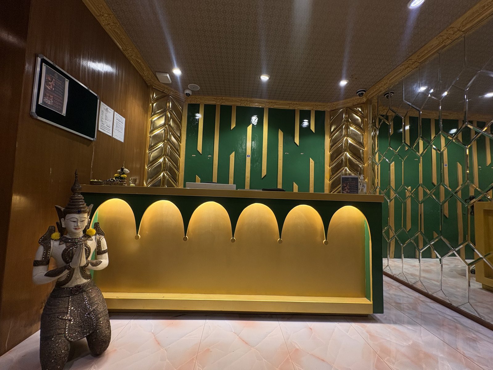 Reception desk with a Thai statue